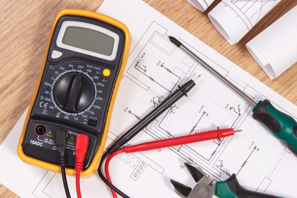 Electrical,Construction,Blueprint,,Drawings,Or,Diagrams,,Multimeter,For,Measurement,In